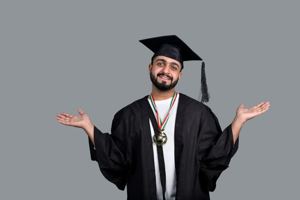 a man wearing a graduation cap and gown